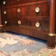 Commodity with mahogany detached columns and Empire gilded bronze ornaments