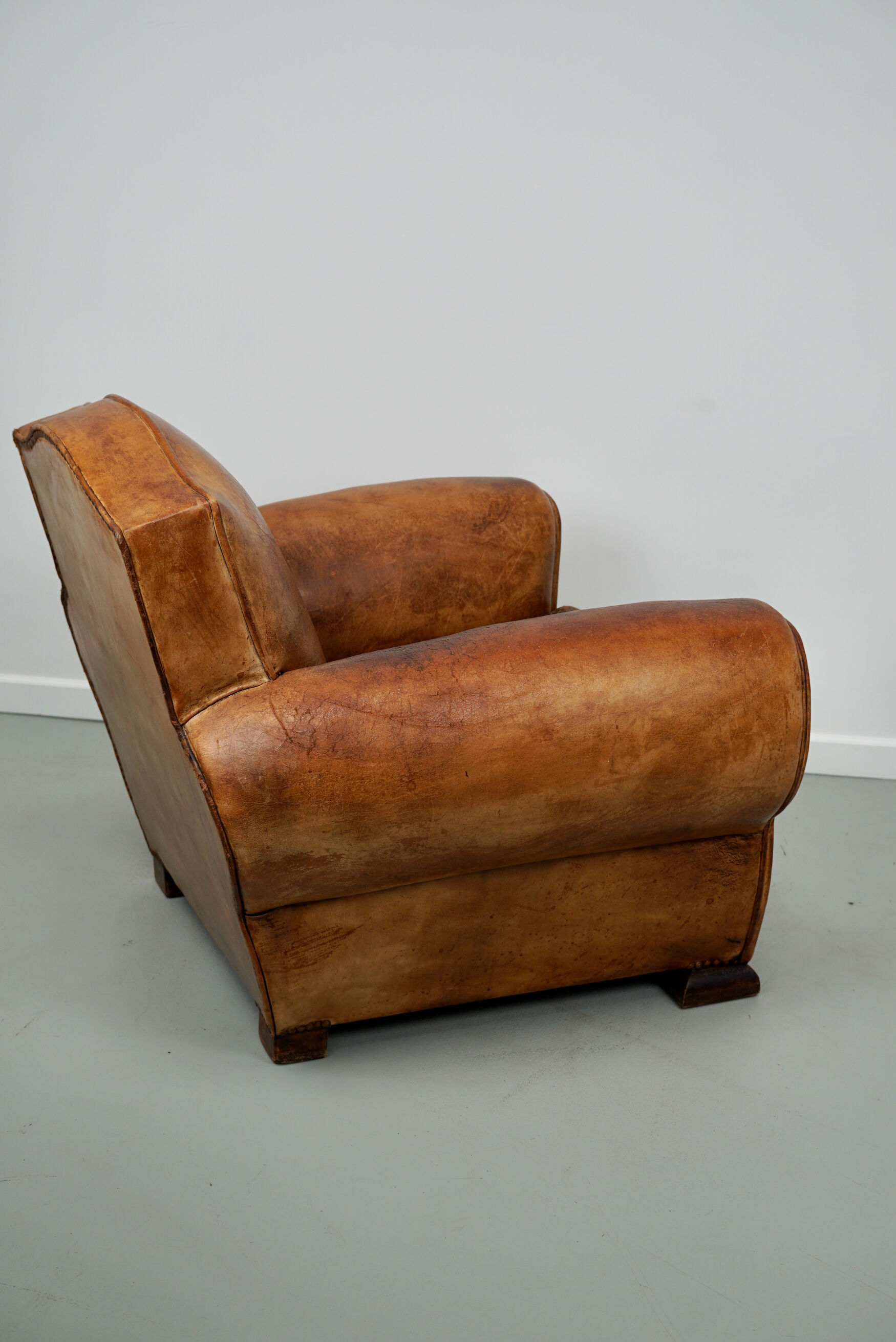 French moustache back cognac-colored leather club chair, 1940s