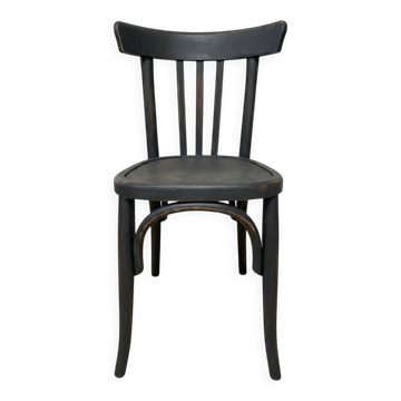 Matte black bistro chair with a patina.