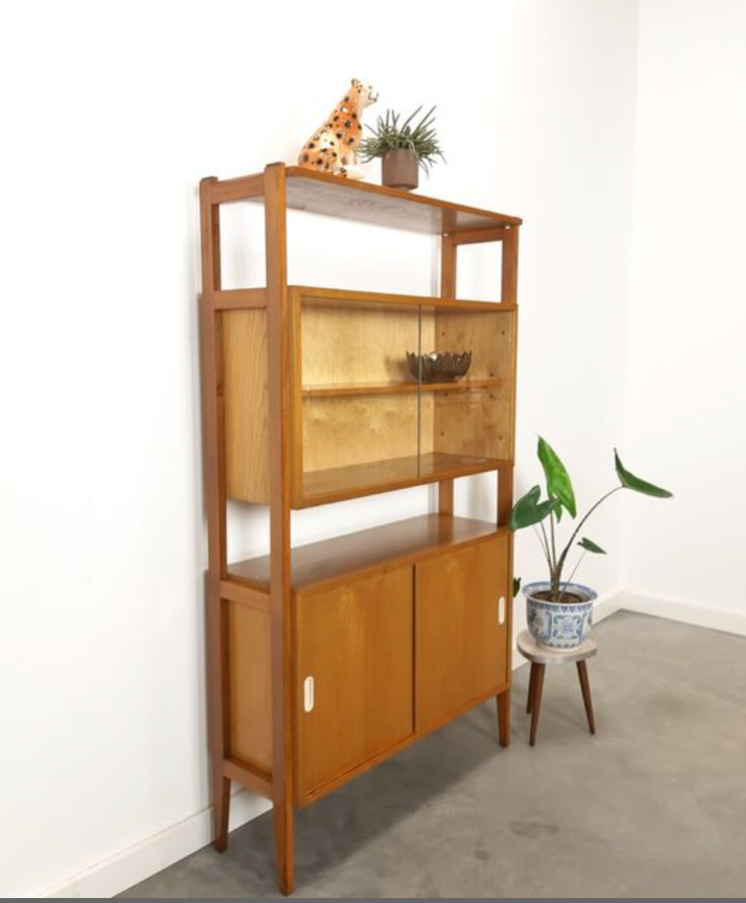 Vintage wooden showcase with sliding doors and white handles