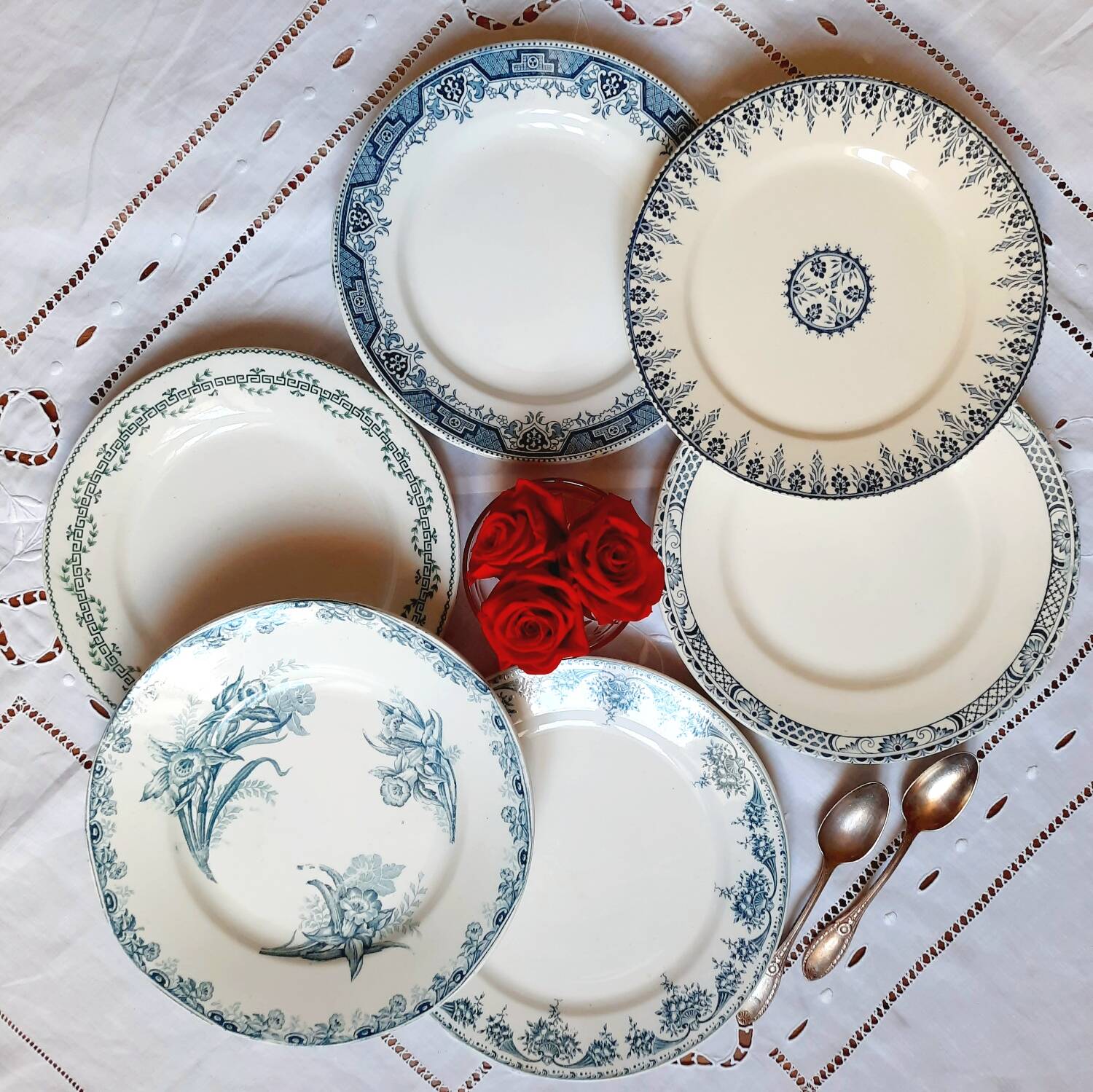 Old mismatched iron earthenware dessert plates accompanied by a dish