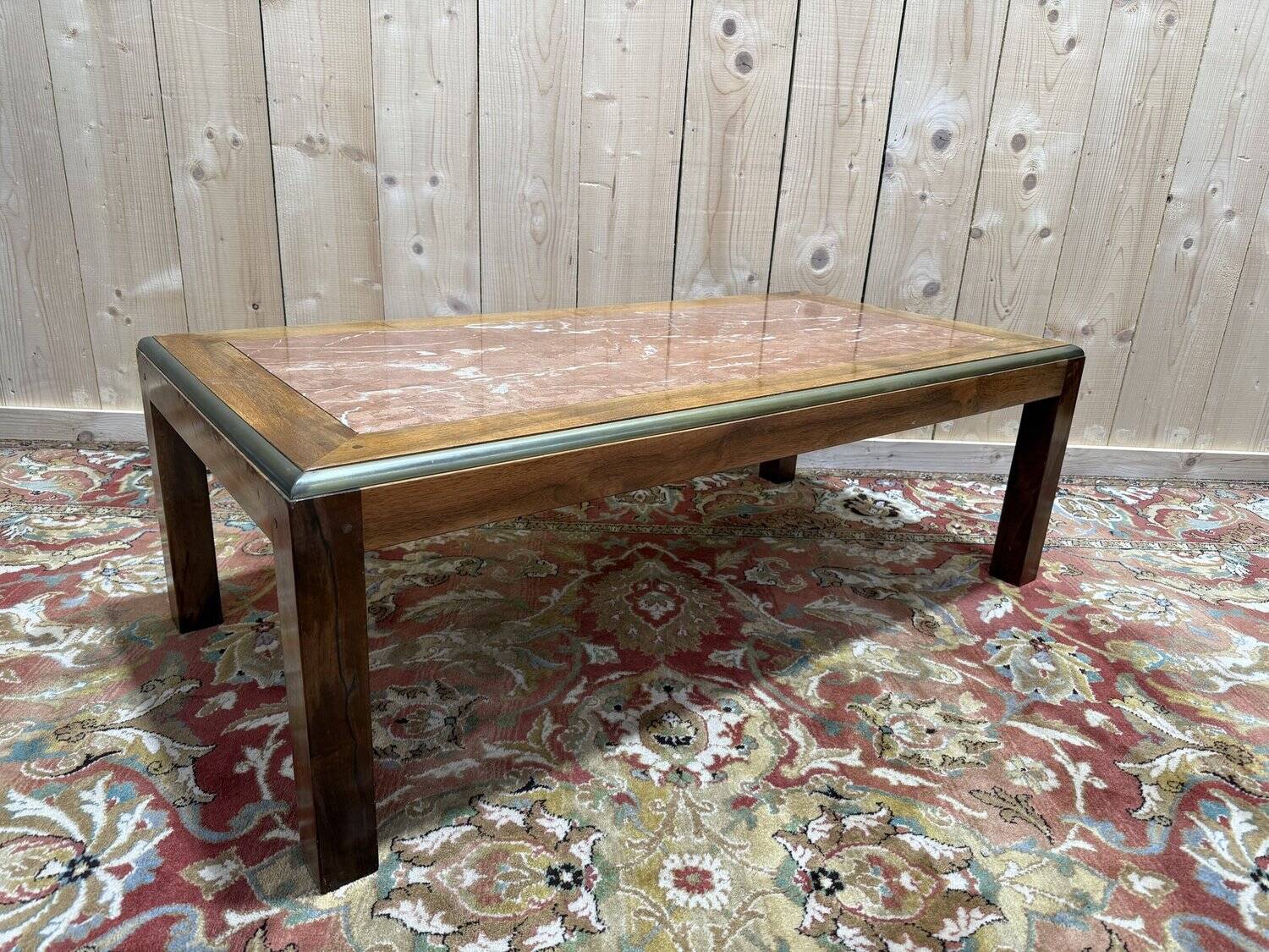 Contemporary coffee table in mahogany and marble.