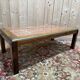 Contemporary coffee table in mahogany and marble.