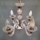 Glass chandelier has 4 lights