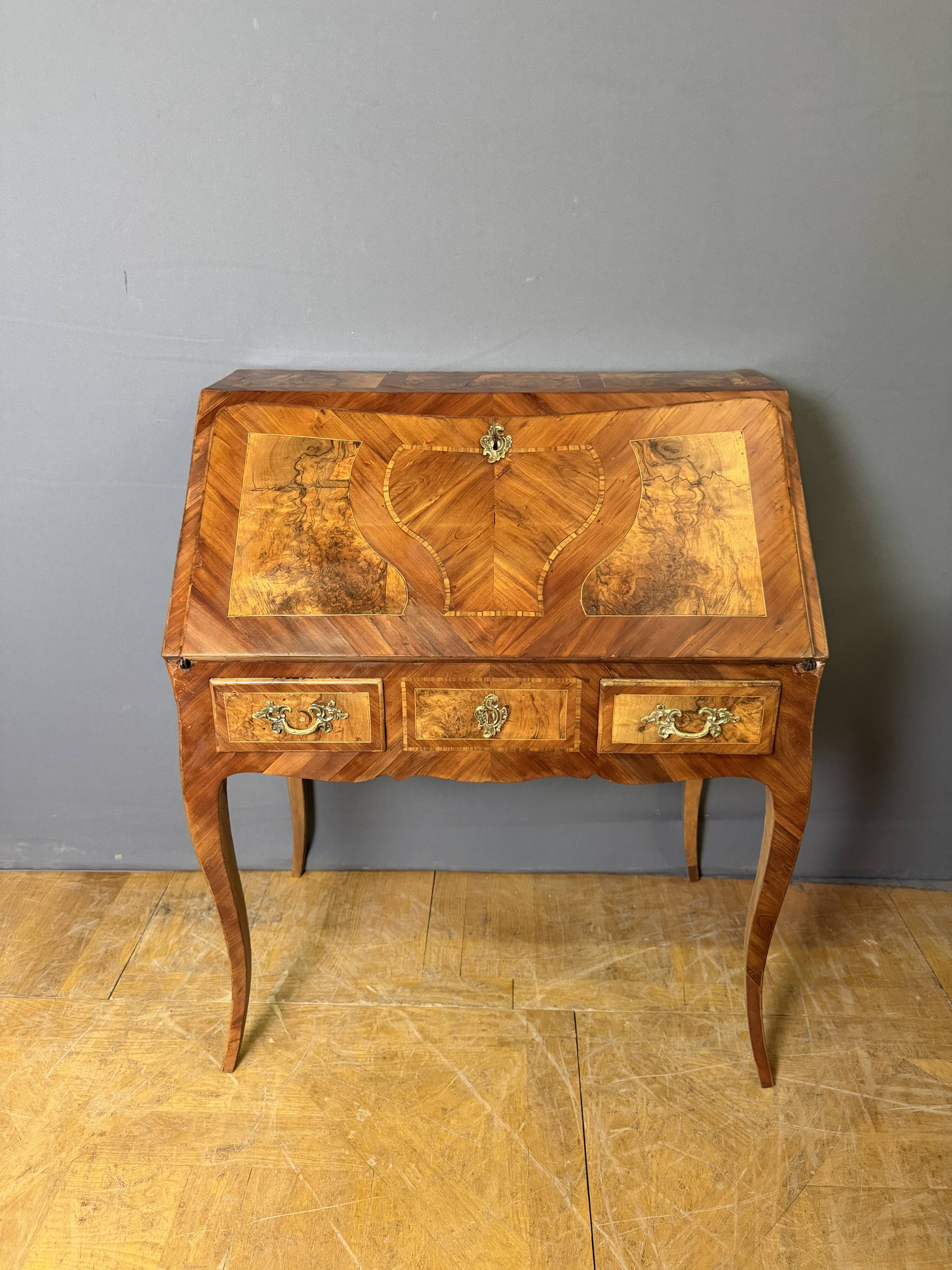 Louis XV slant-top desk in 18th-century marquetry.