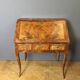Louis XV slant-top desk in 18th-century marquetry.