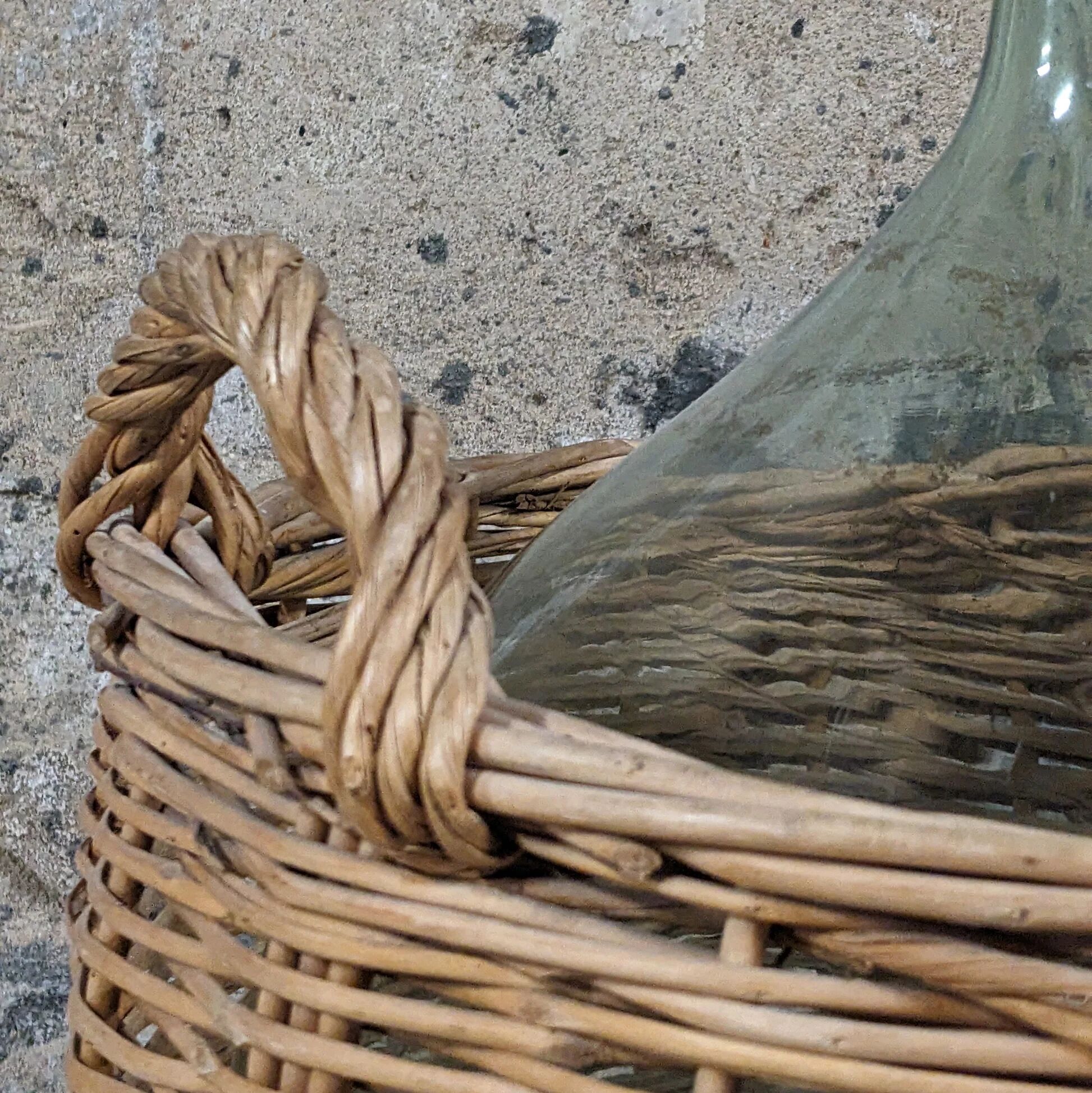 Demijohn in its wicker basket