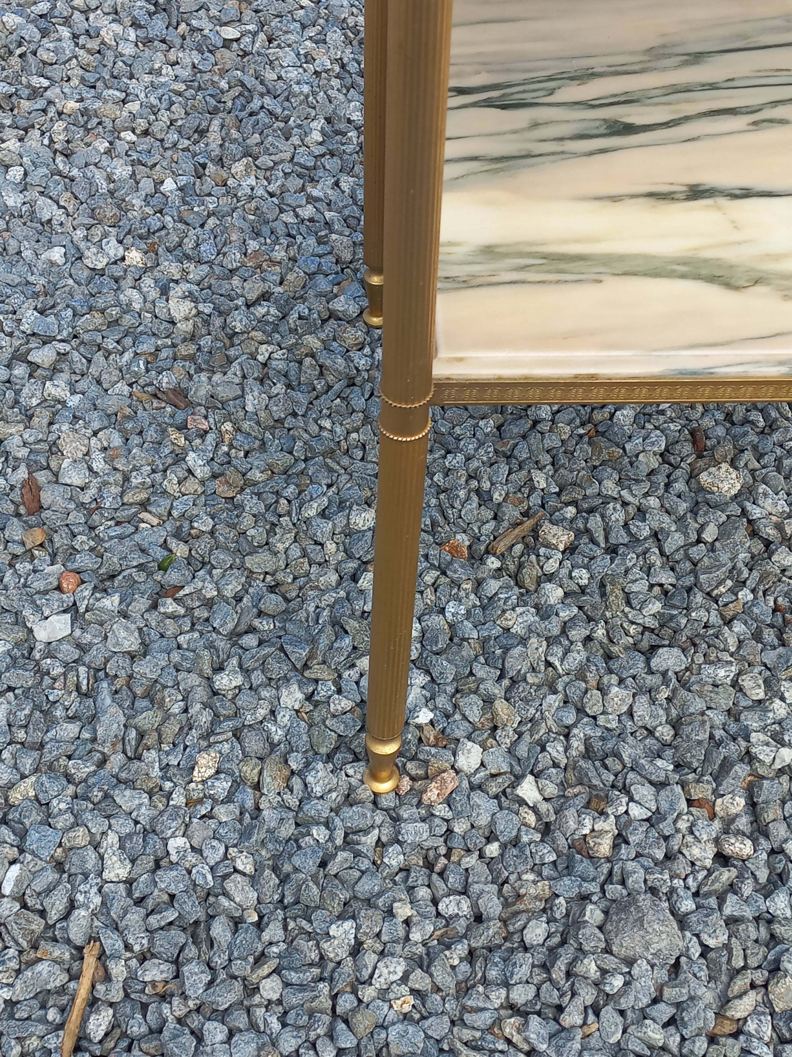 Pair of neoclassical side tables in bronze, brass, marble, and o.