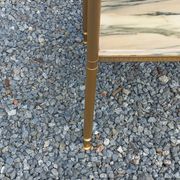 Pair of neoclassical side tables in bronze, brass, marble, and o.