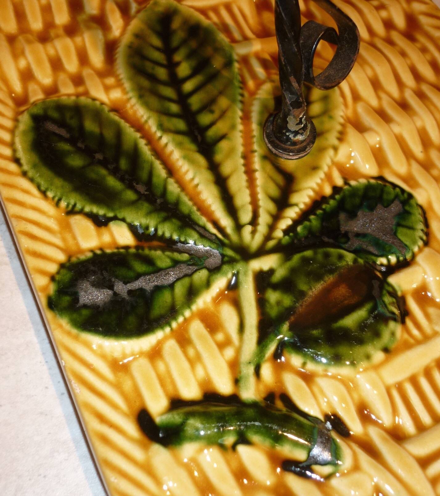 Braided yellow cheese platter and wrought iron