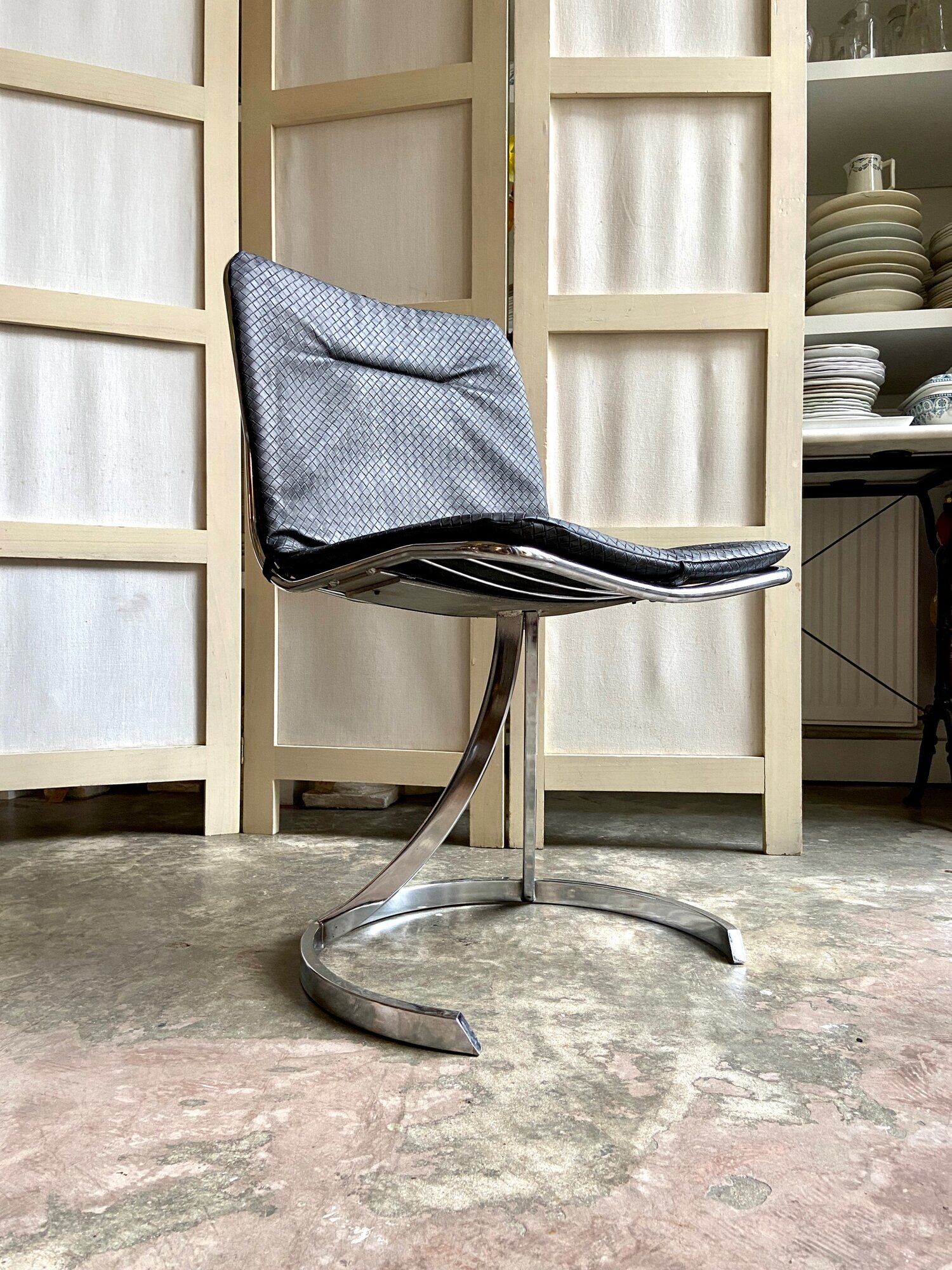 2 chairs in chromed metal and black woven skaï 1970s