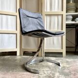 2 chairs in chromed metal and black woven skaï 1970s