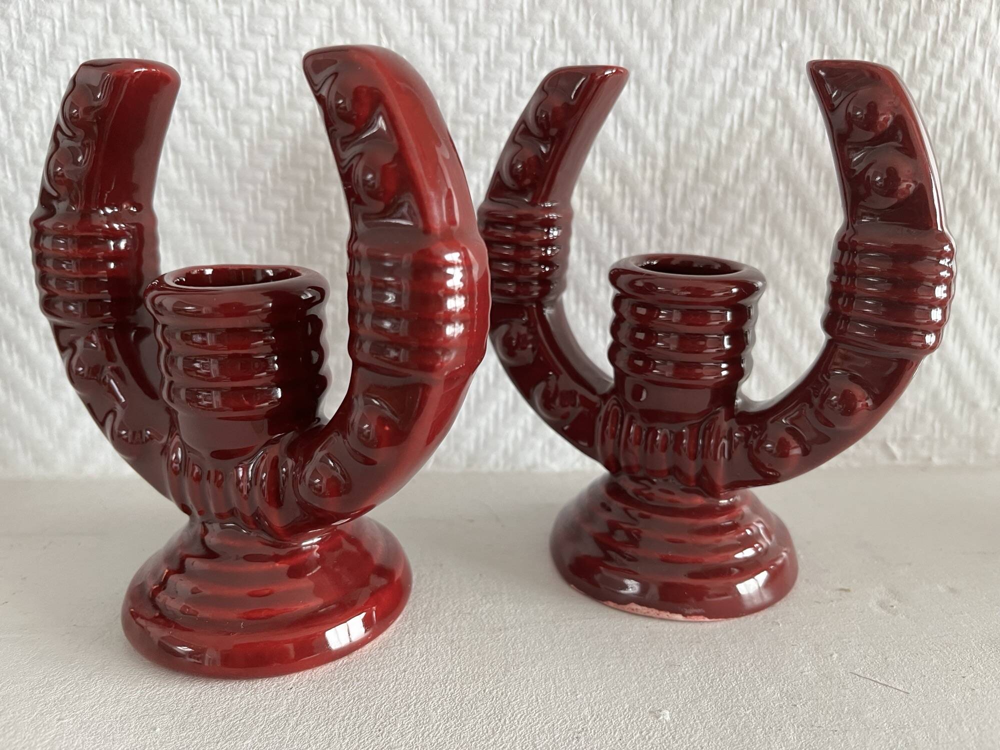 2 fifties red ceramic candle holders, horseshoe pattern