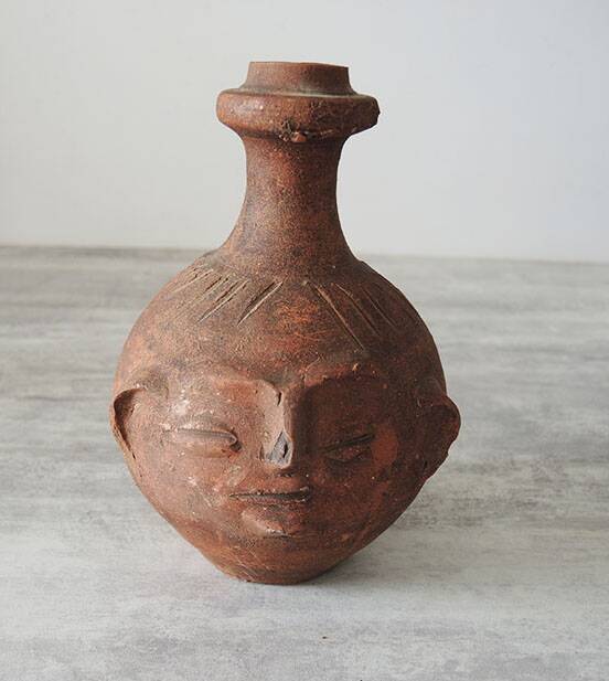 Old anthropomorphic terracotta vase pitcher