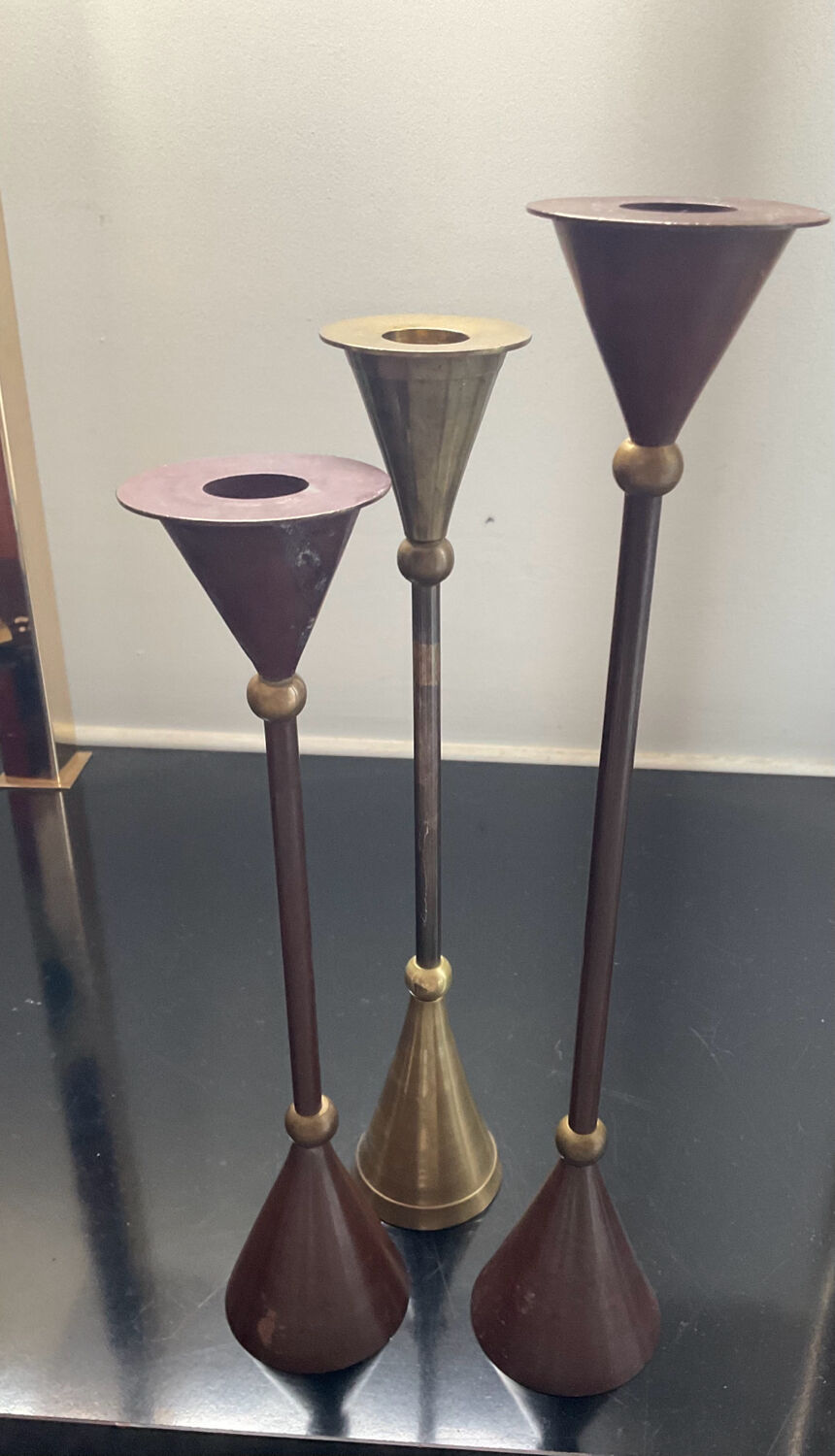 Trio of vintage brass and copper candle holders