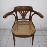 Wooden armchair with caned base