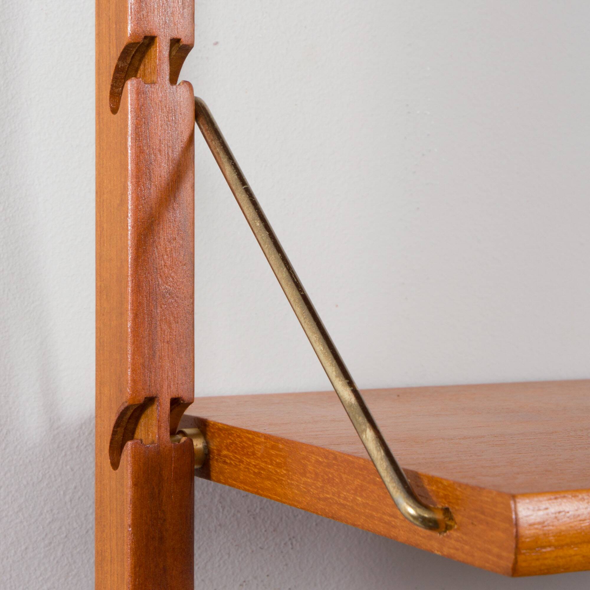 Scandinavian modern wall shelving system Ergo in teak by J. Texmon, Norway, 1960s