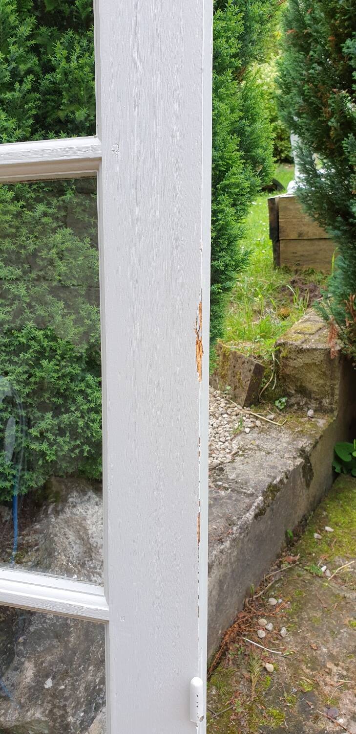 Old wooden door with small squares