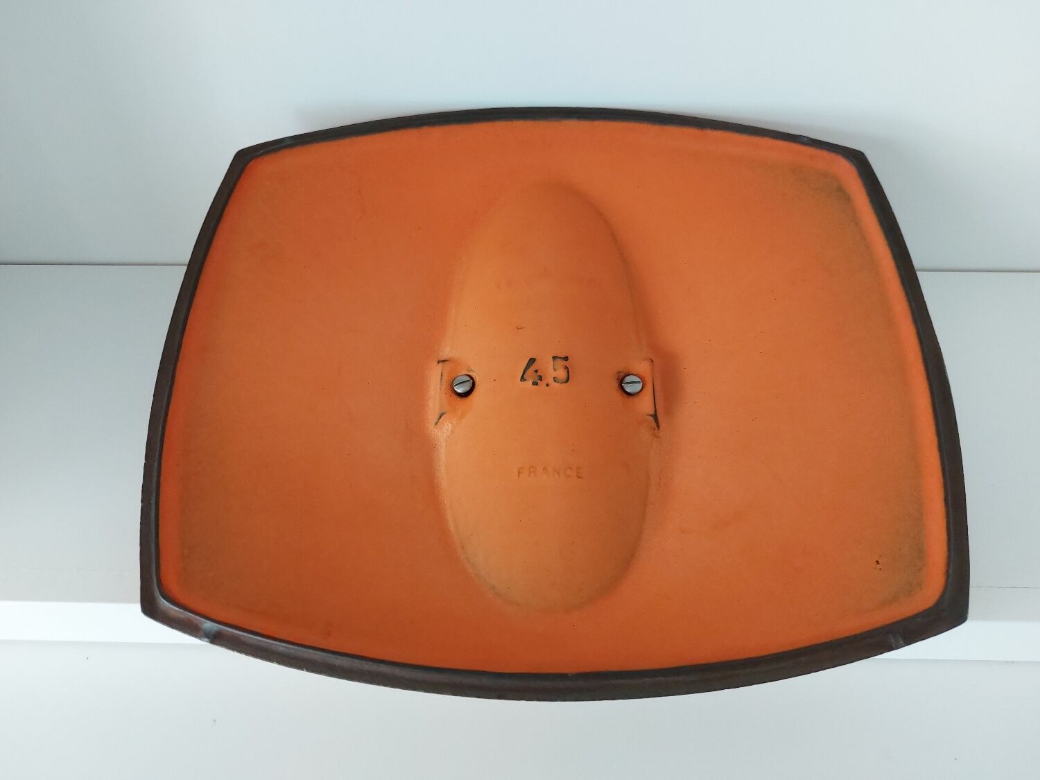 Double casserole in orange cast iron Le Creuset design Raymond Loewy