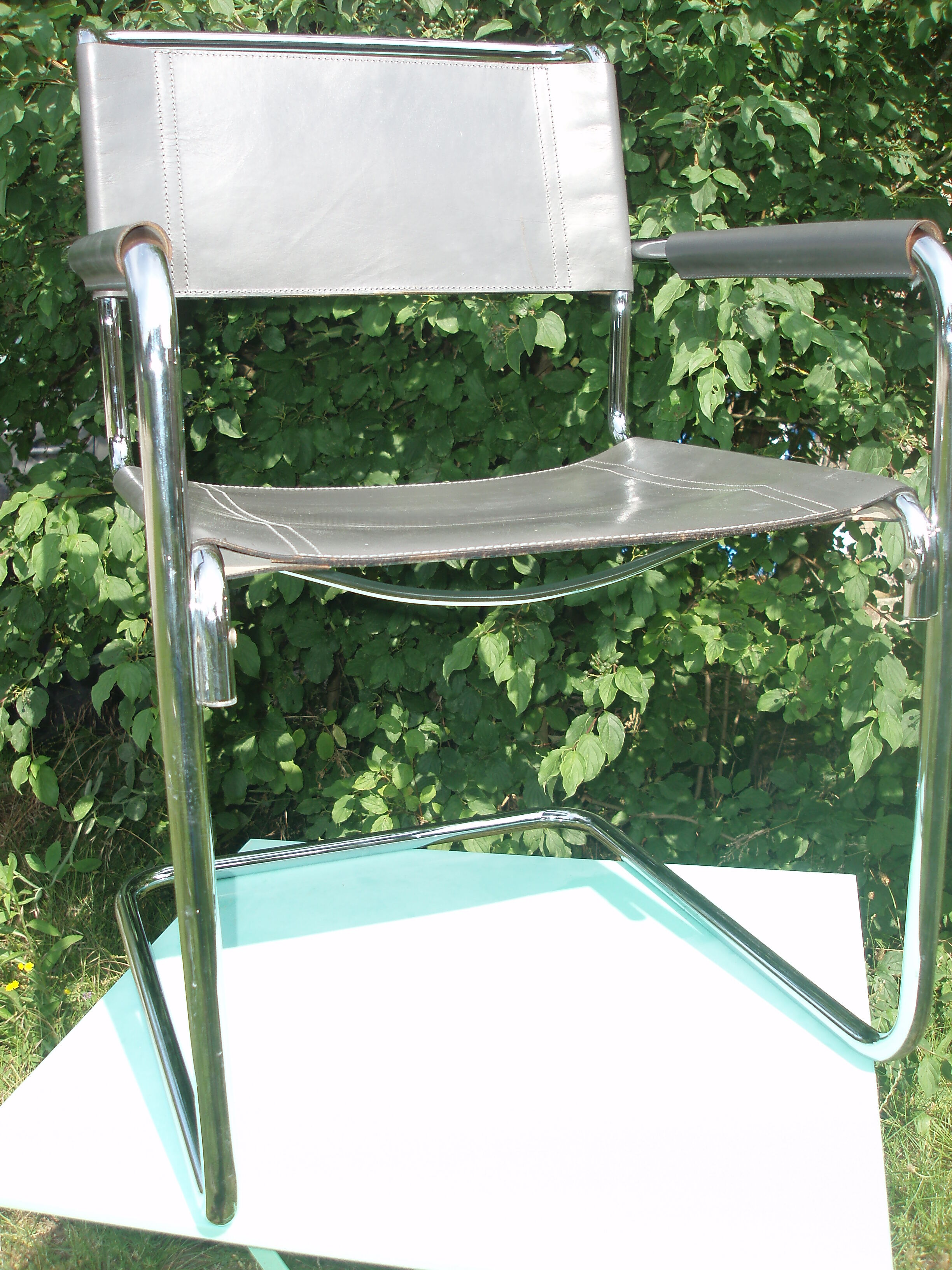 Series of grey and chrome leather armchairs