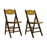 Pair of vintage folding chairs year 50 sculpted backrest.