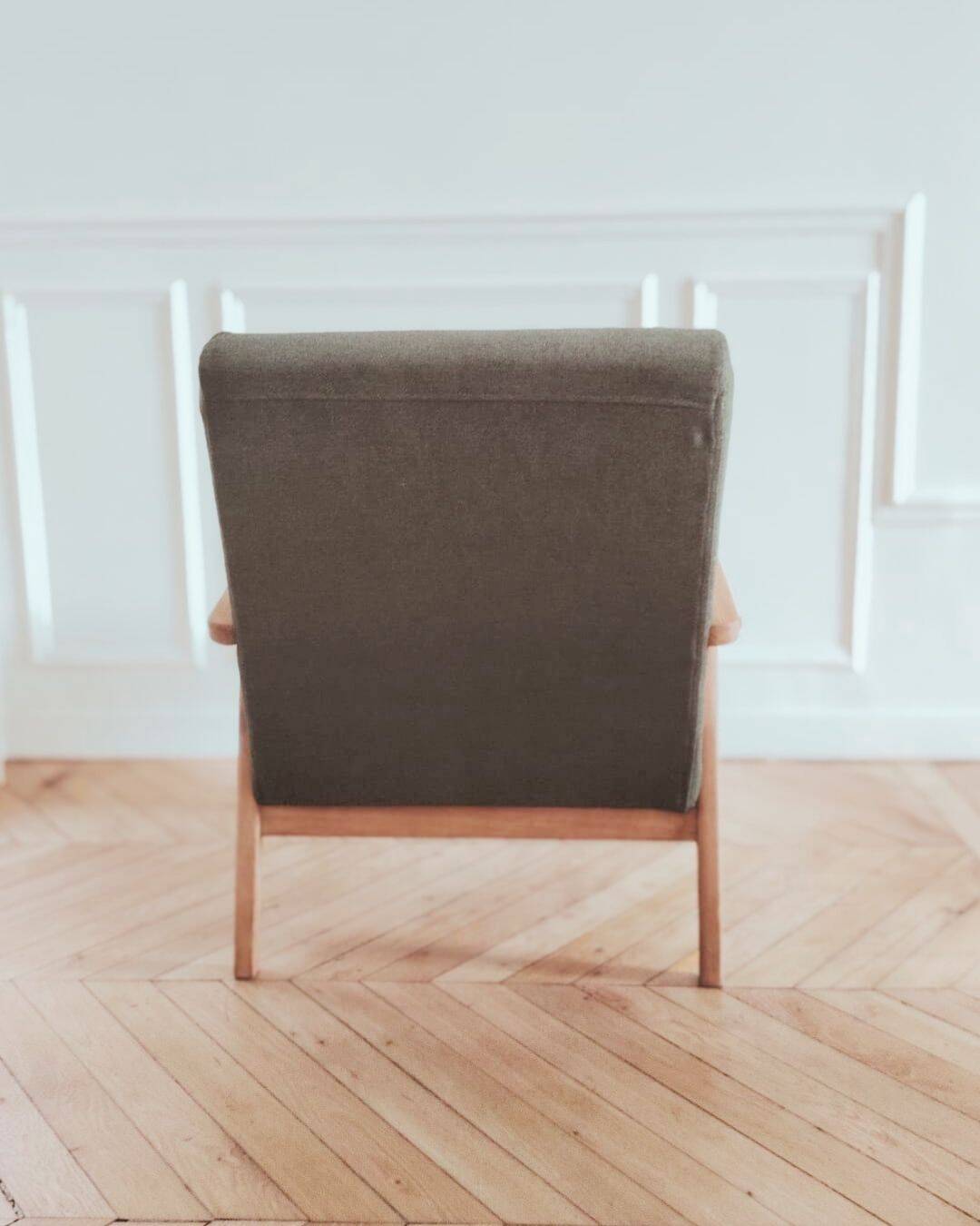 Renovated armchair, Scandinavian style in wood and green fabric.