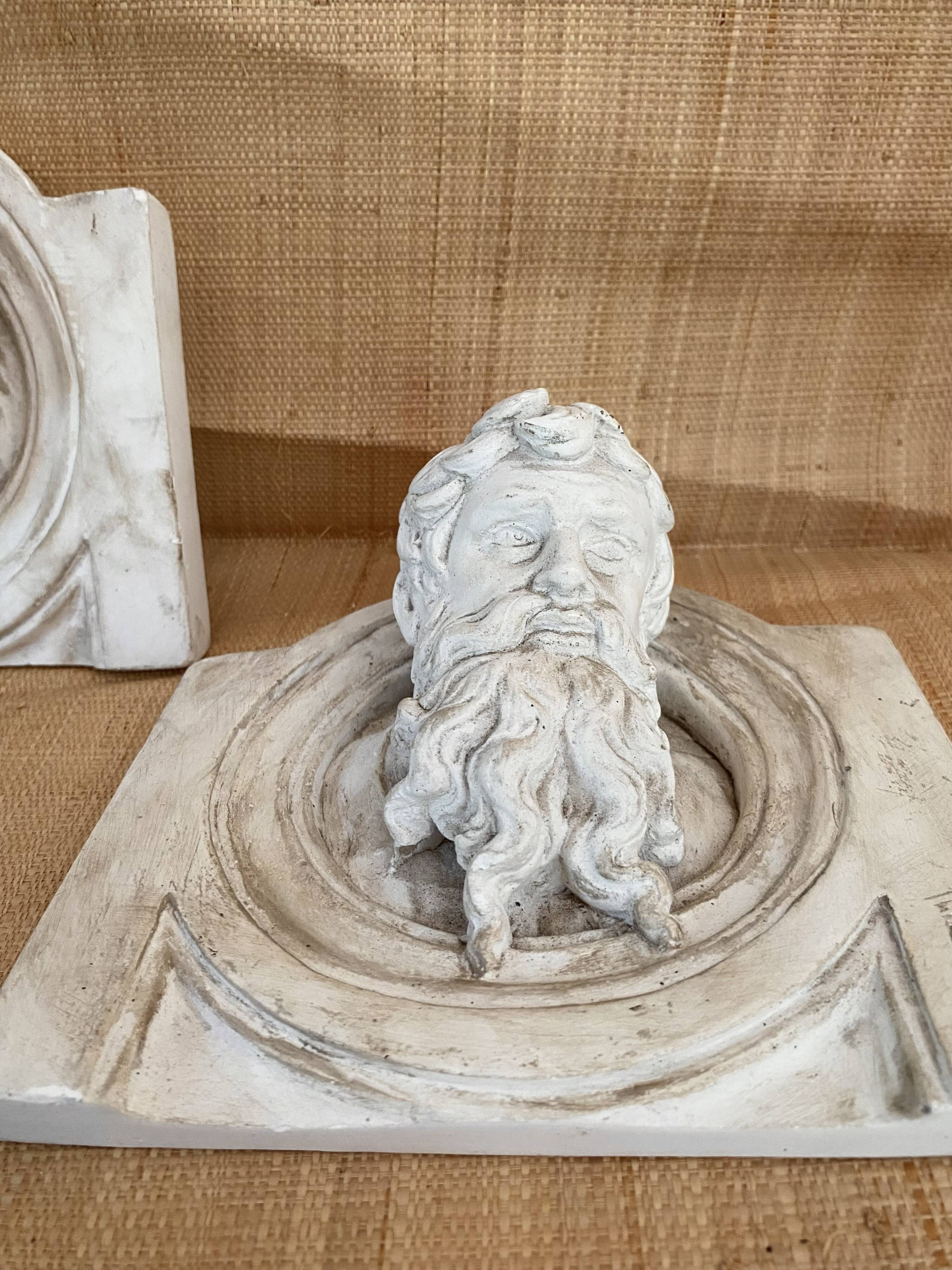 Two moulds; plaster heads