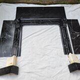 Pompadour fireplace with black marble modillions