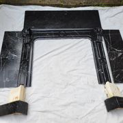 Pompadour fireplace with black marble modillions