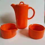 Coffee pot has orange 1970 sugar milk