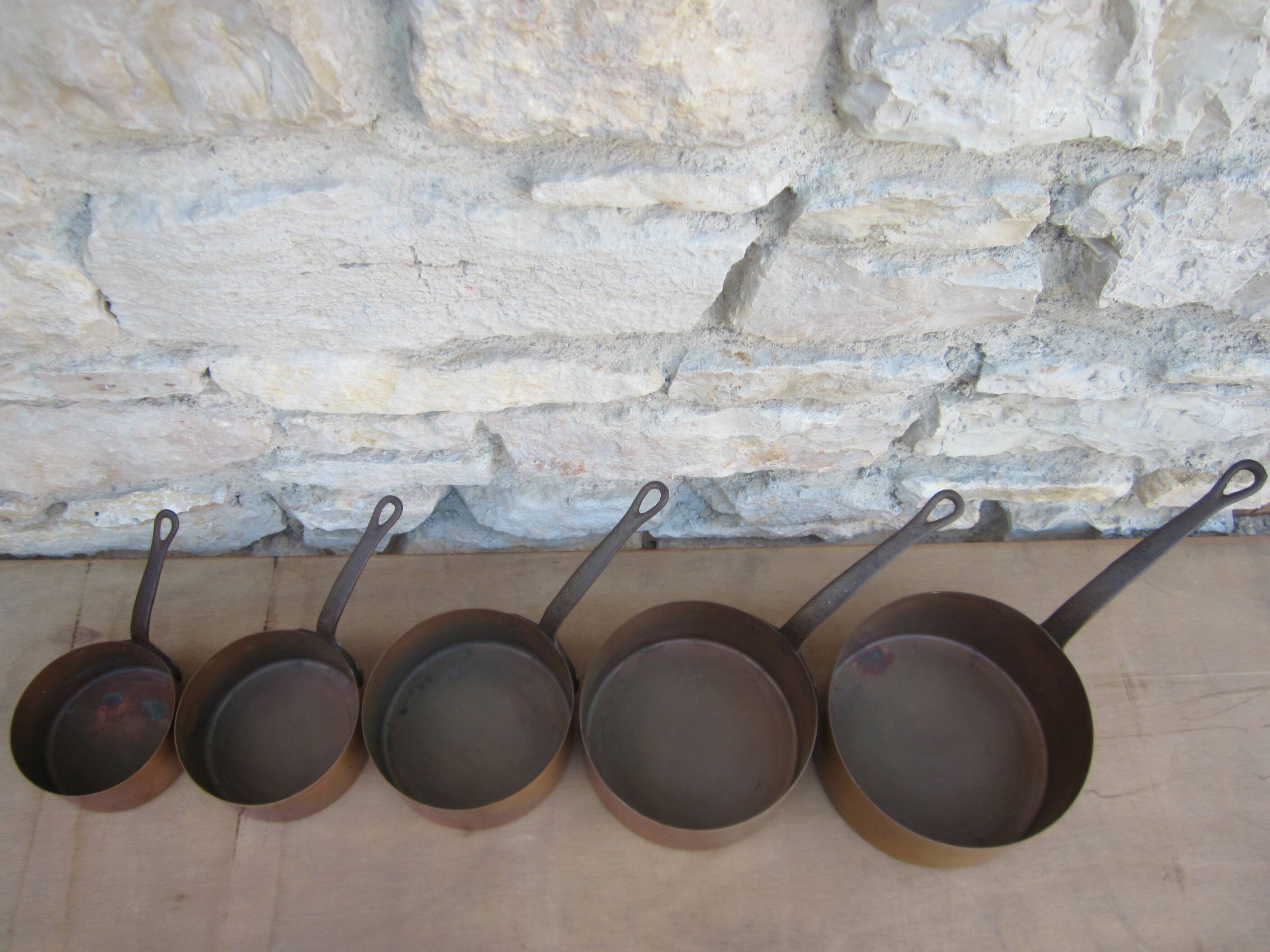 Set of 5 copper saucepans