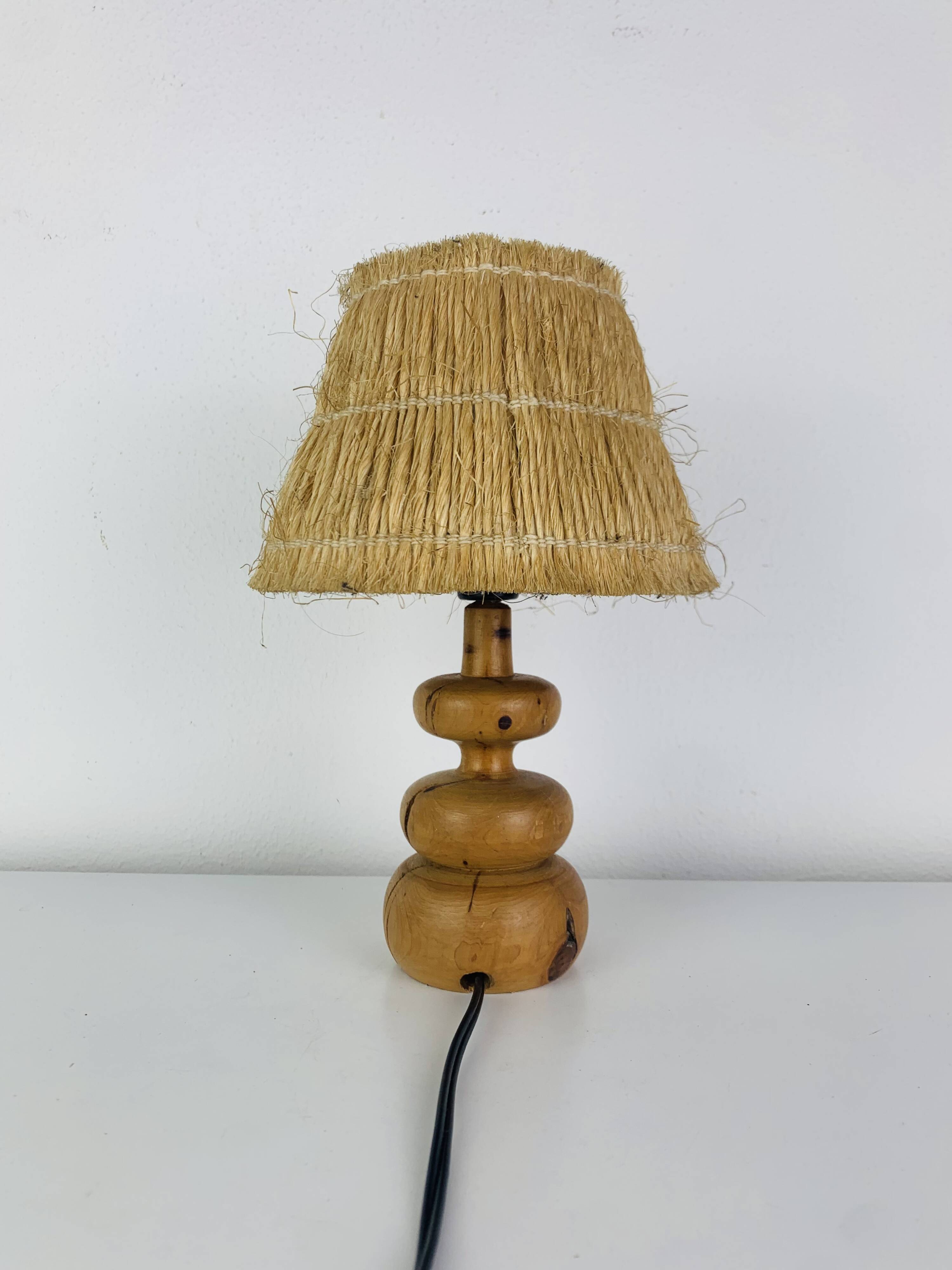 Turned wood lamp with straw shade, 1960s, vintage