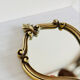 Small antique mirror in baroque style – gold frame in bronze or brass.