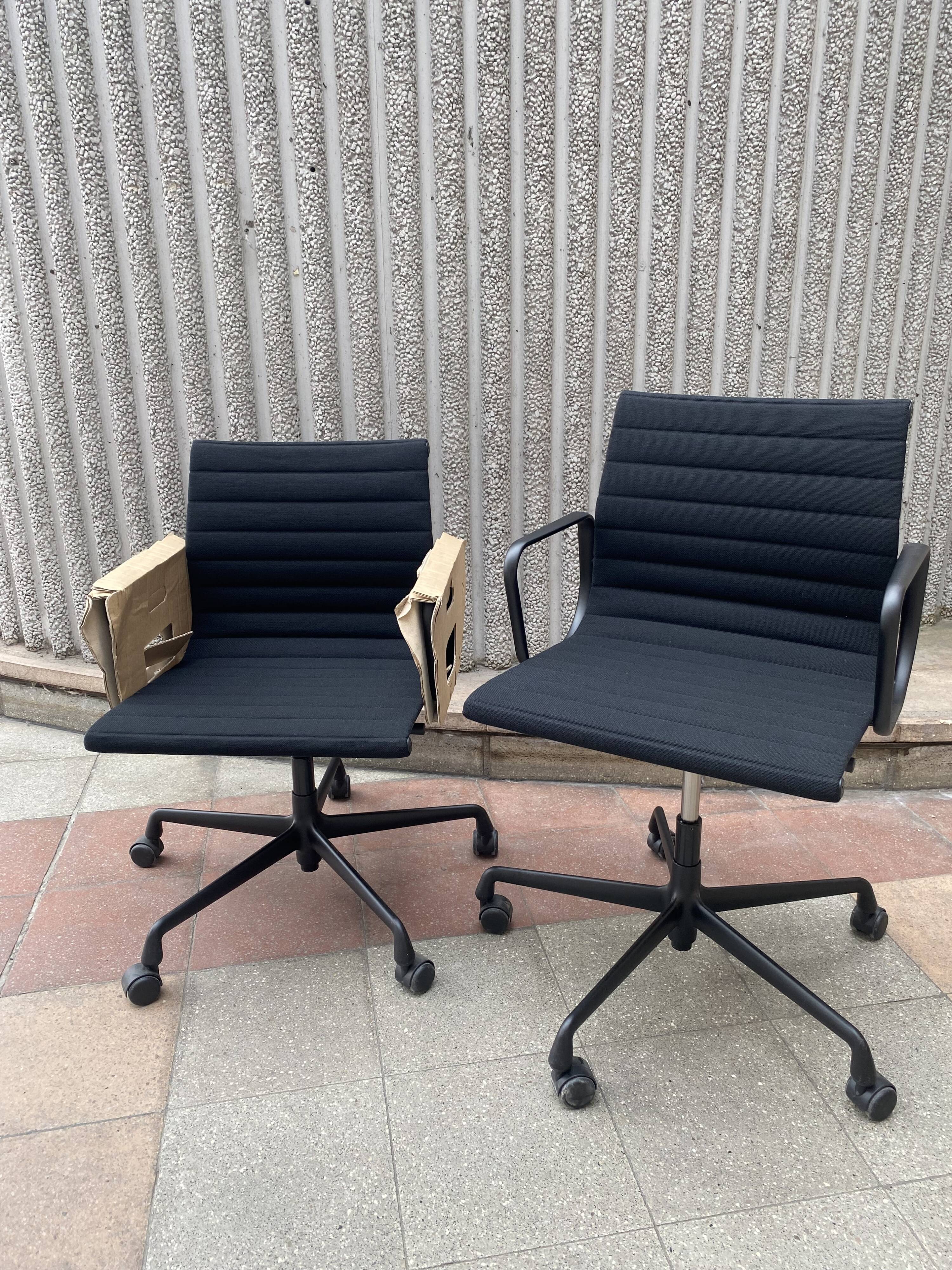 2 Charles Eames EA118 armchairs