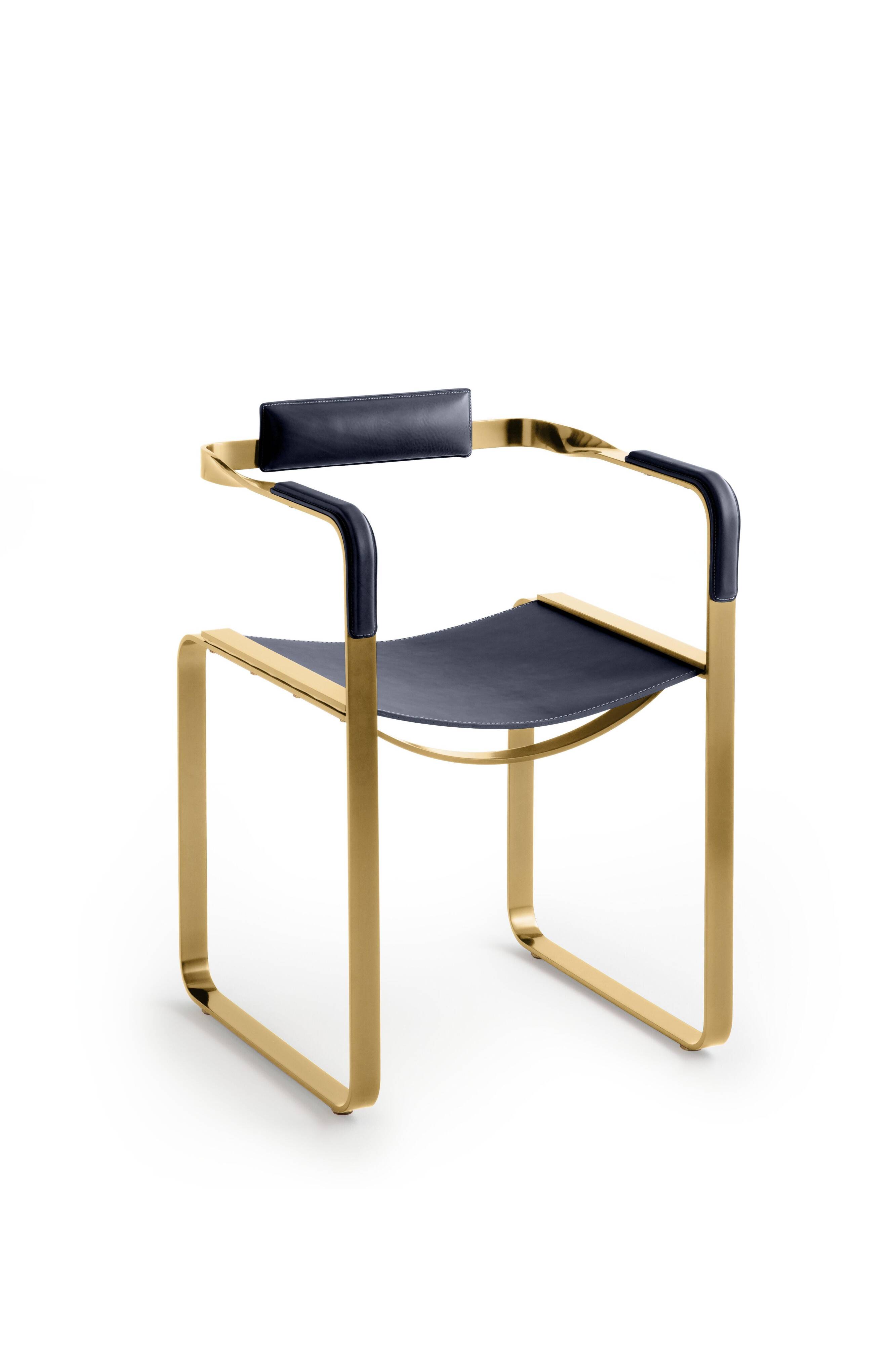 Armchair, aged brass and navy blue leather, contemporary style.