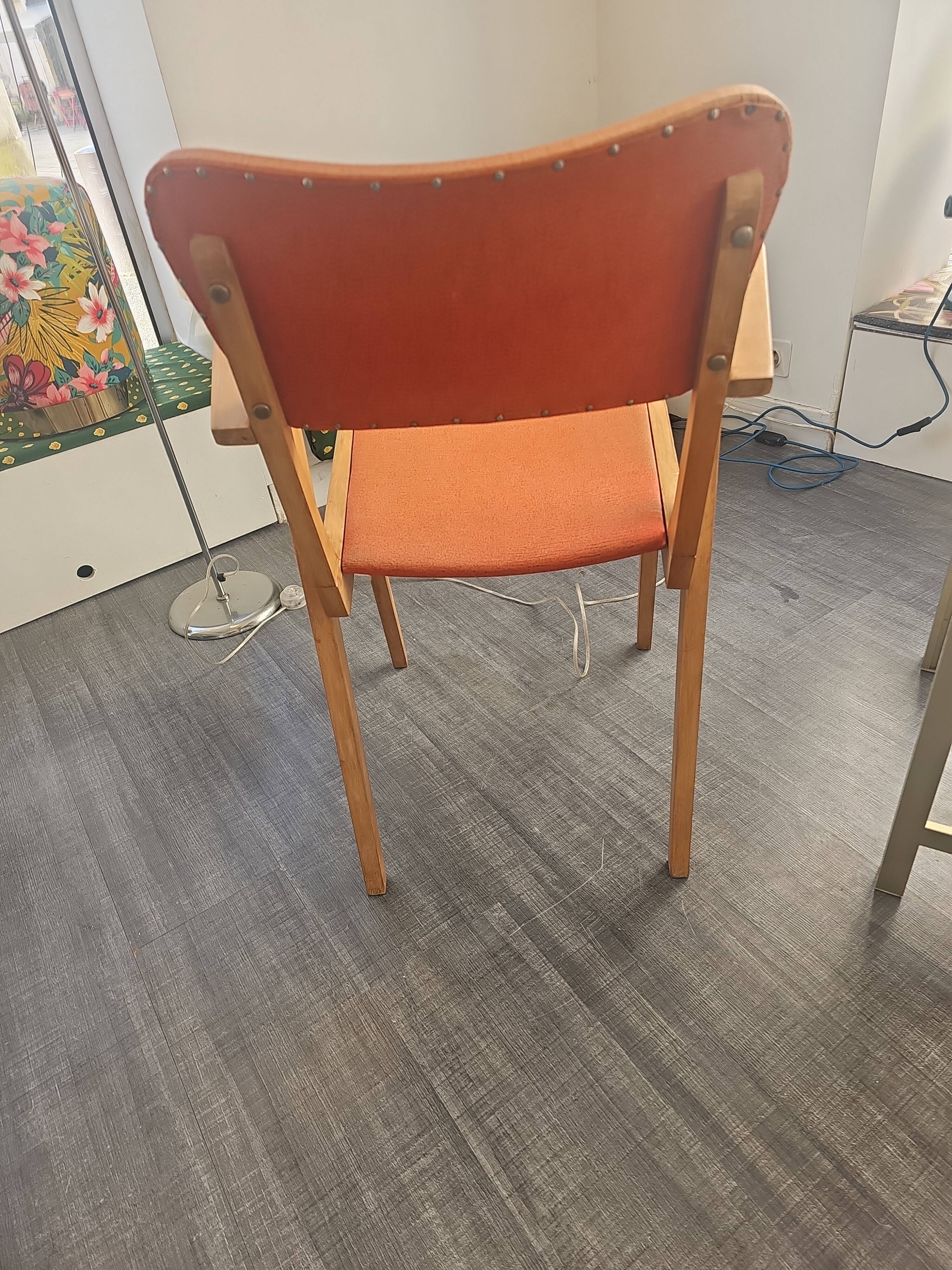 Modernist armchair in wood and orange fabric
