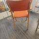 Modernist armchair in wood and orange fabric