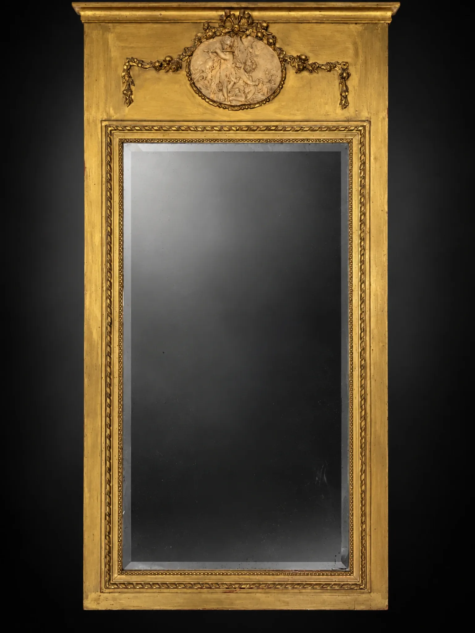 Golden trumeau mirror in Louis XVI style