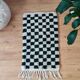 Small Berber rug with green tiles.