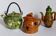 Set of old teapots and honey pot