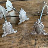 Series of 12 monogrammed silver metal knife holders