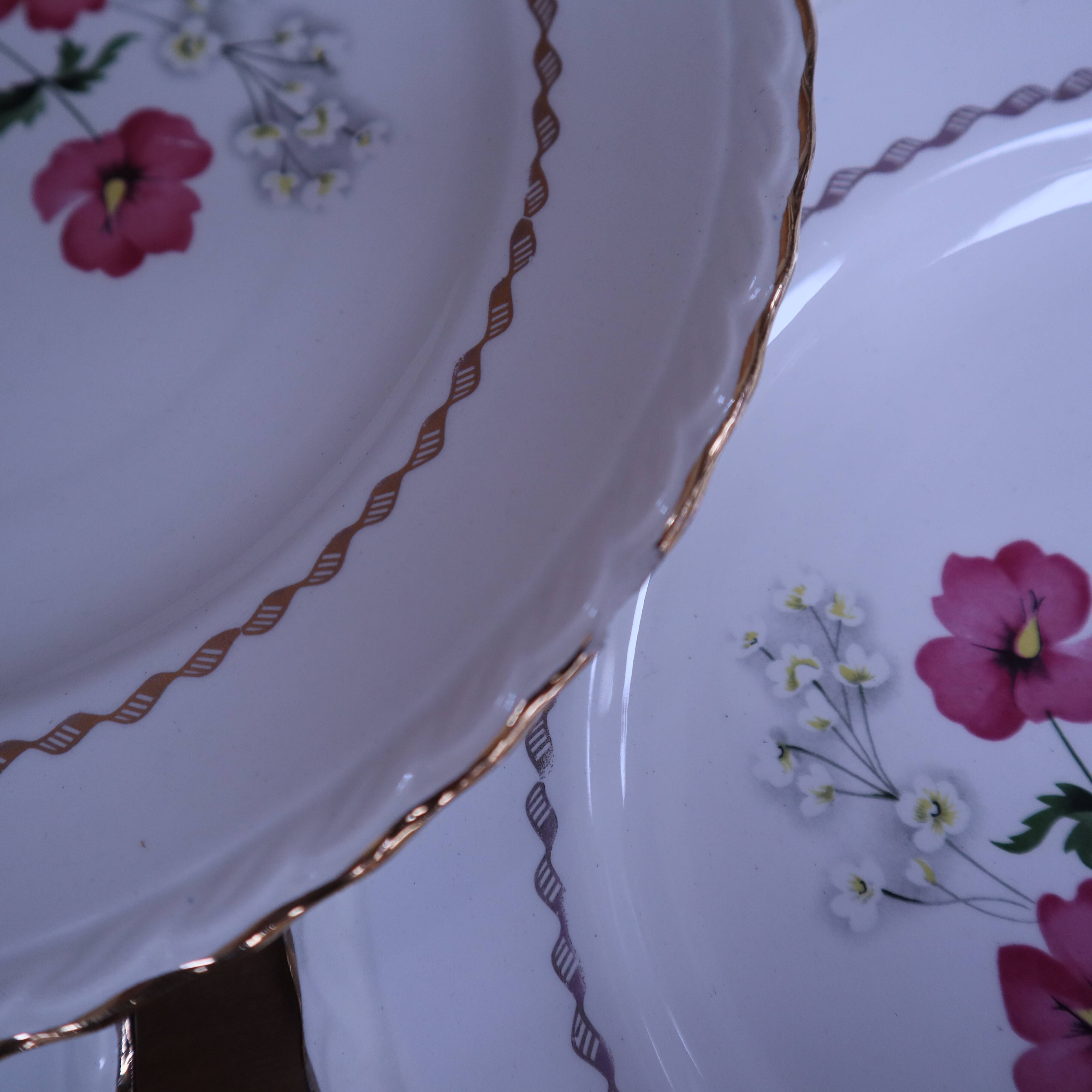 6 flat plates in earthenware l'Amandinoise with floral decoration.