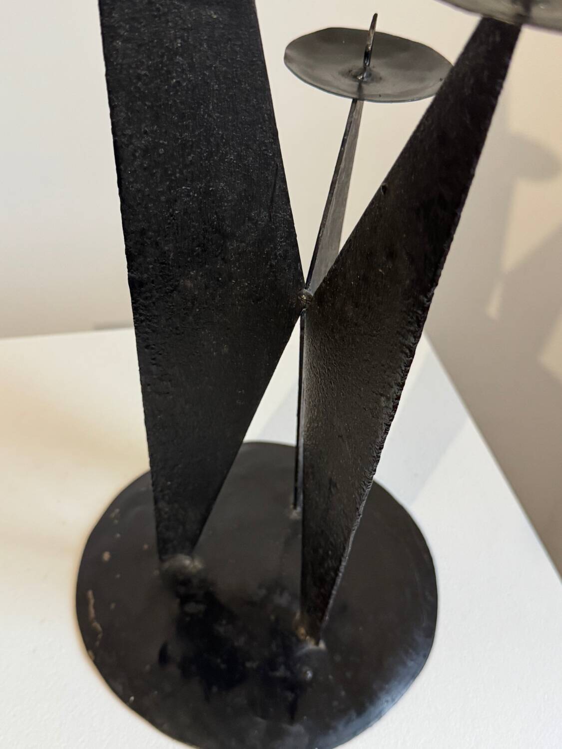 Vintage black metal brutalist tripod candlestick
