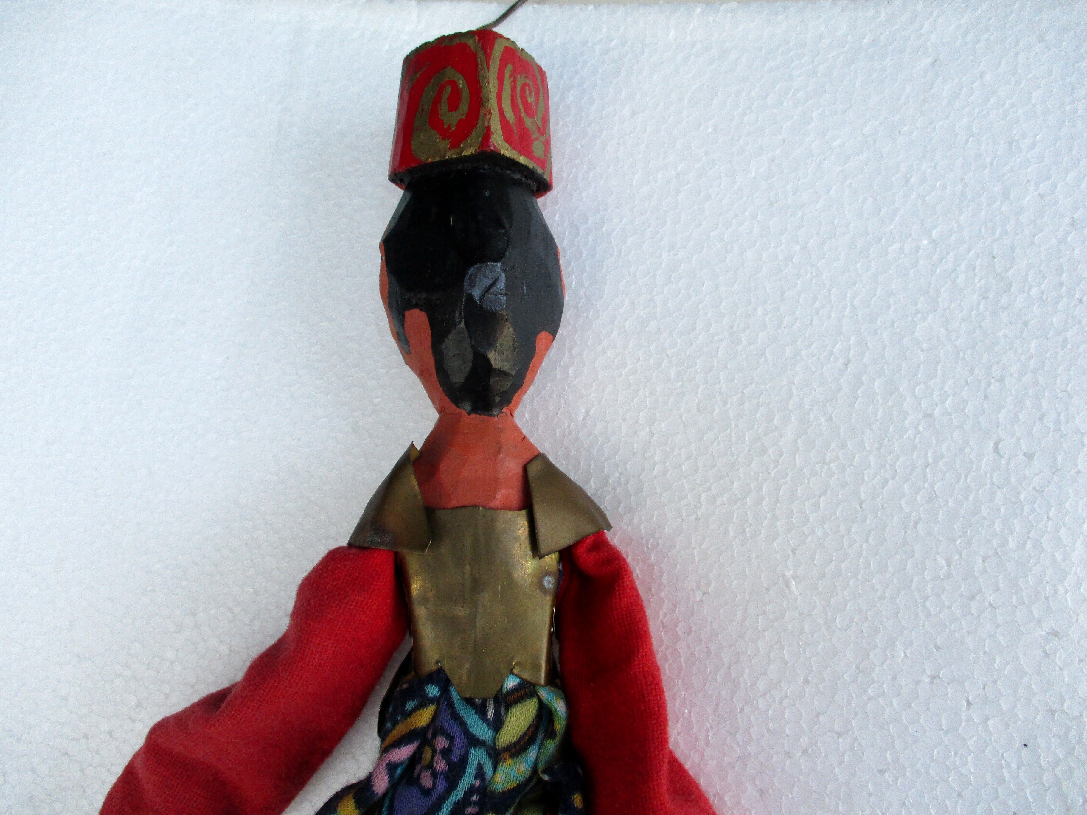 Asian puppet, wood and brass
