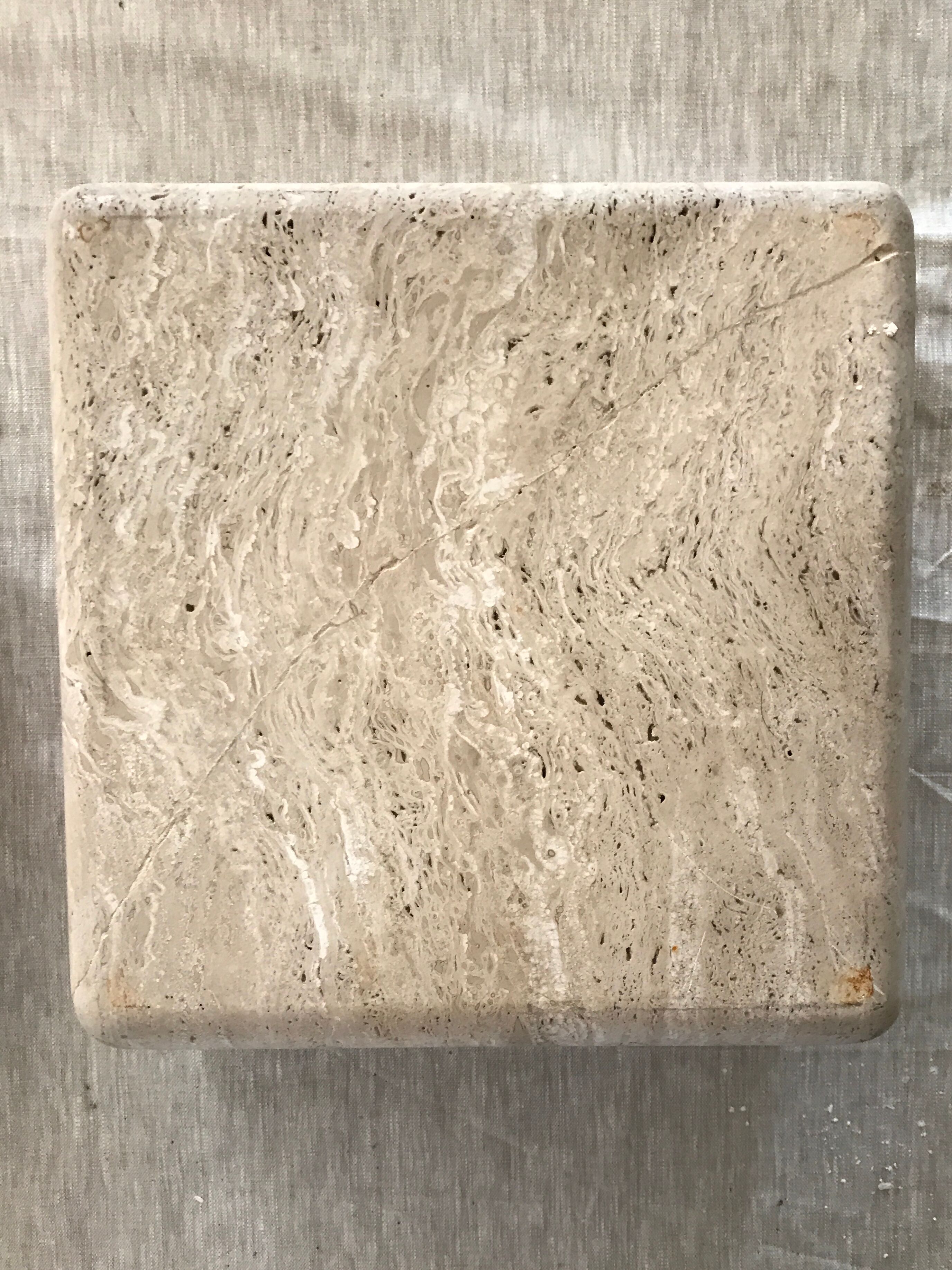 Sculptural travertine coffee table