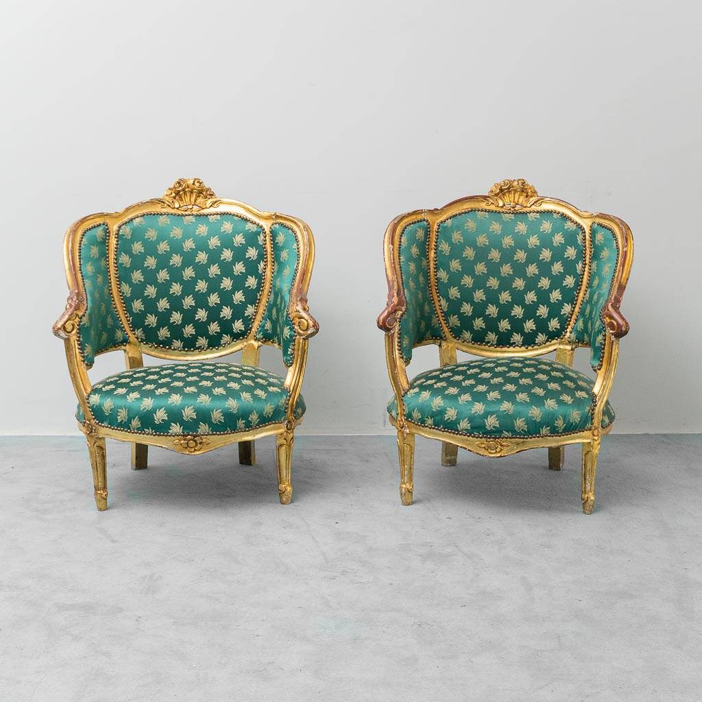 Pair of Louis XV style gilded armchairs with vintage green fabric