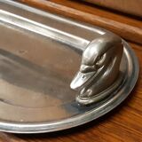 Silver dish with foie gras, duck heads