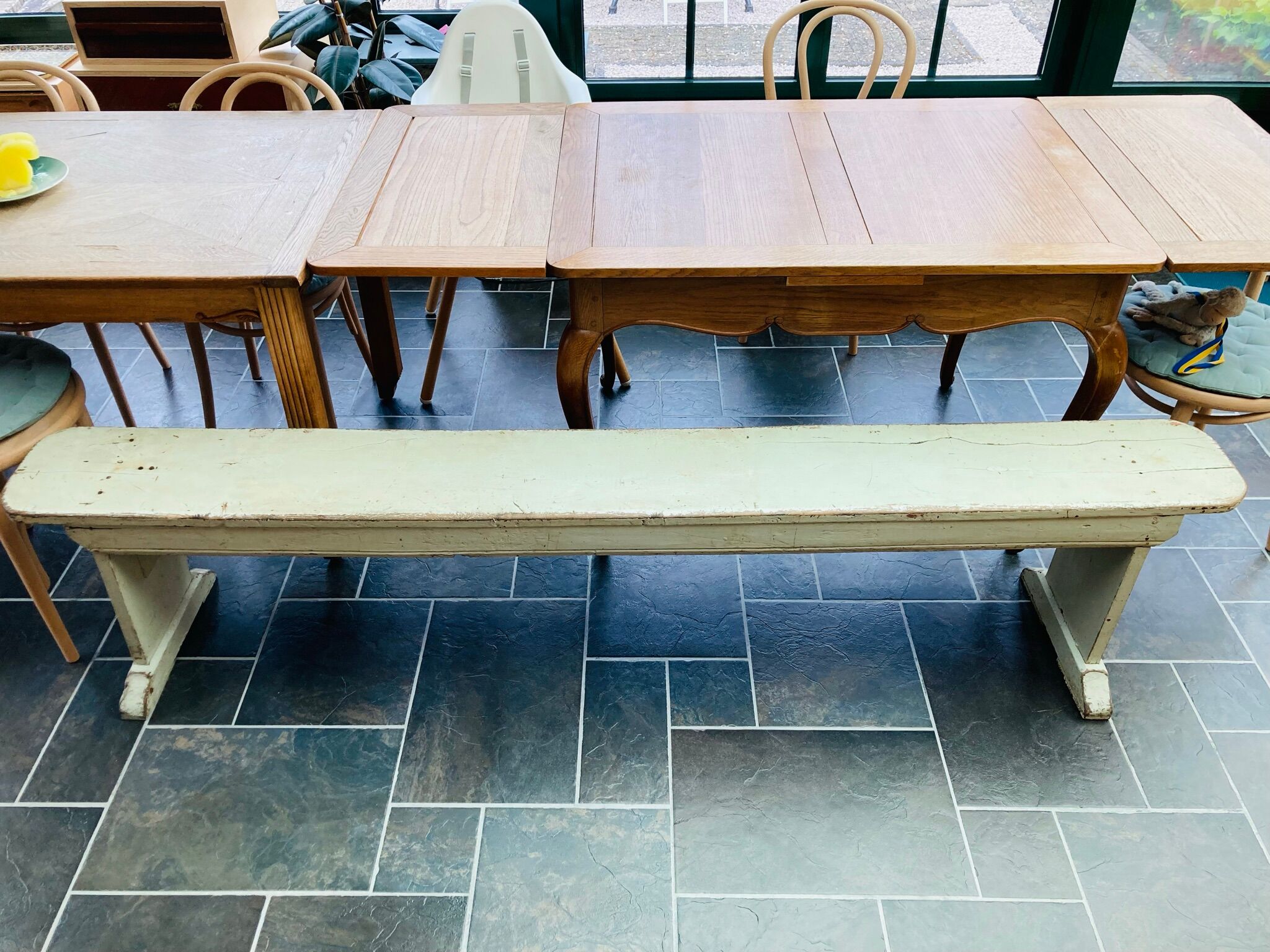 Old wooden bench painted in light green