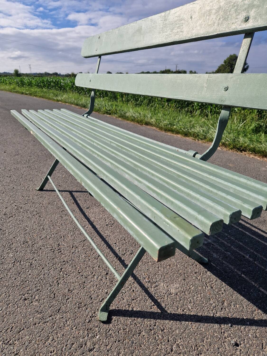Ancien banc de jardin pliant en fer forgé vert