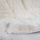 Tapis artisanal en laine naturelle